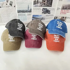 Vintage washed cotton baseball caps with I'M BOB embroidery in five assorted colors