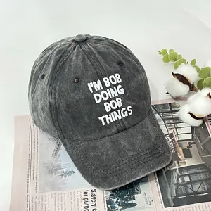 Vintage gray washed cotton baseball cap with I'M BOB print in 45-degree view
