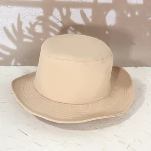 Minimalist beige cotton sun hat for hiking with reinforced brim and natural shadows