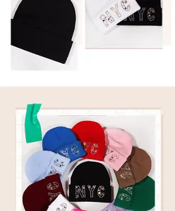 Detailed multi-color display of NYC rhinestone knit beanies in various vibrant shades