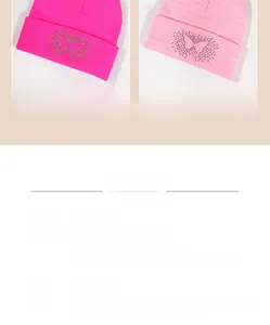Detail of knitted beanies in hot pink and light pink with sparkling rhinestone butterfly
