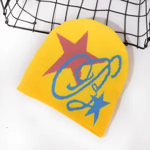 Yellow knitted beanie with red star and blue graffiti patterns for outdoor winter warmth