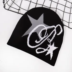 Knitted beanie hat with star pattern for outdoor winter warmth in black and grey