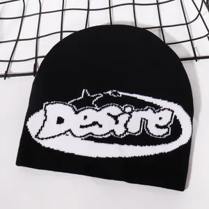 Macro detail of Desire jacquard knit pattern on black winter beanie with soft texture