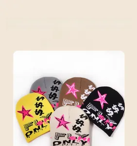 Detailed knit texture of colorful jacquard beanies featuring Fun Only star patterns
