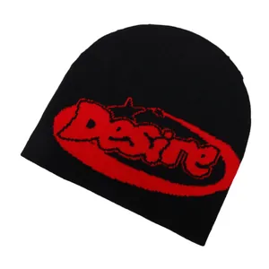 Black knit beanie with red Desire jacquard lettering in a trendy streetwear style