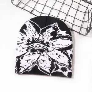 Streetwear jacquard knit beanie with white floral patterns on black background
