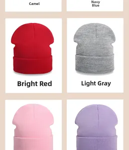 Detail view of knitted beanie hats showing various colors including red and light grey