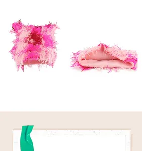 Detail of plush cat ear knit hat showing fluffy pink gradient yarn and inner lining
