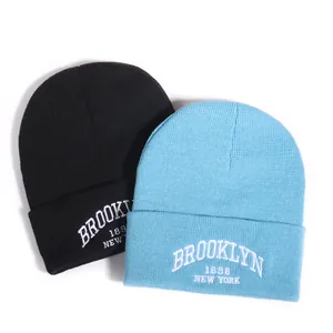 Knitted beanie hat in black and light blue with Brooklyn New York white embroidery