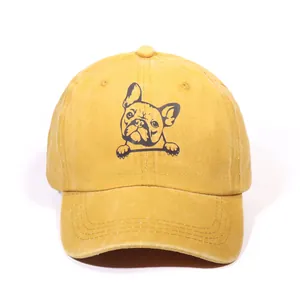 Washed cotton baseball cap in ginger yellow featuring a pug print and curved brim