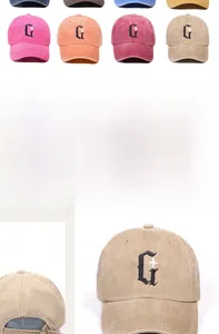 Detail of washed cotton baseball cap featuring gothic letter G and star embroidery