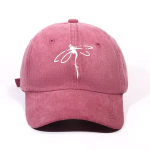 Washed cotton baseball cap in vintage red featuring a white dragonfly print for unisex
