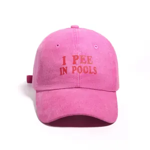 Fuchsia washed denim baseball cap with humorous 'I PEE IN POOLS' red letter print