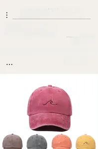 Détail de la broderie vague et de la texture en coton lavé vintage des casquettes