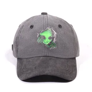 Washed dark gray baseball cap with a green alien print and distressed street style look