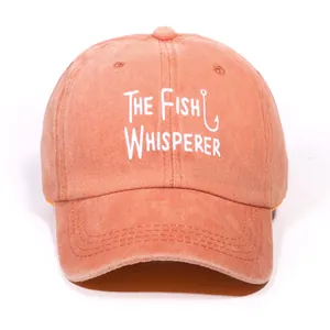 Vintage washed coral orange baseball cap with The Fish Whisperer embroidery detail
