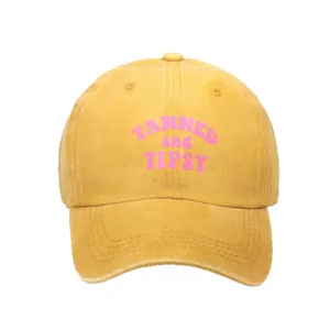 Washed ginger cotton baseball cap with TANNED and TIPSY pink printed text for men and women