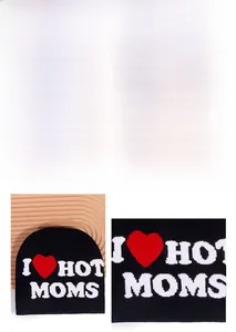 Detail view of the I Love Hot Moms black knitted beanie with red heart embroidery
