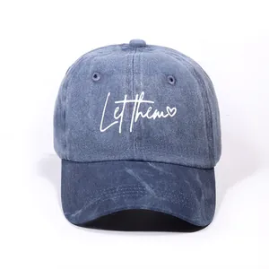 Classic washed blue baseball cap with Let them embroidery and a curved brim for sun protection