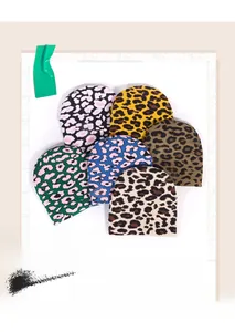 Detailed view of six assorted leopard print jacquard knitted beanies in various colors