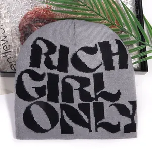Grey knit beanie with Rich Girl Only jacquard lettering for winter street style fashion