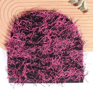 Fuzzy knit beanie hat in black and pink mix, featuring fluffy textures for winter warmth