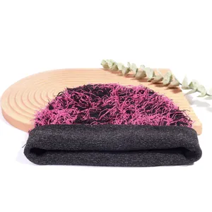 Chic pink and black textured knit beanie with fuzzy top and ribbed cuff for winter warmth