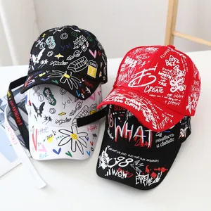Close-up of graffiti print detail on cotton baseball caps with street style lettering