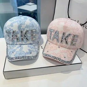 Lace baseball caps with rhinestone TAKE lettering in light blue and pink pastel colors