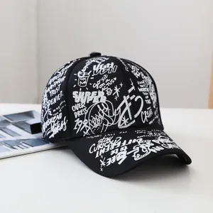 Close-up of graffiti print on black cotton baseball cap with urban streetwear lettering