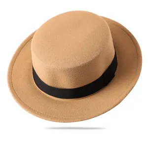 Elegant camel wool boater hat with a black ribbon band, classic wide brim winter headwear
