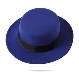 Detailed view of royal blue wool fedora featuring flat brim and black grosgrain ribbon