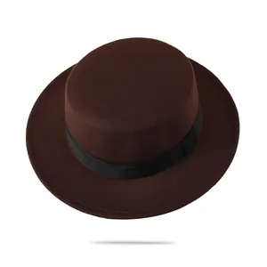Detailed macro view of the brown wool felt boater hat with a black grosgrain ribbon trim