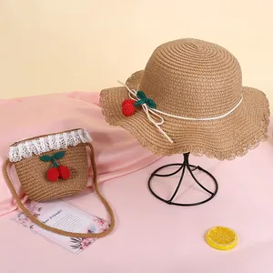 Straw sun hat and matching crossbody bag set with cherry accents for kids outdoor vacation
