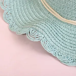Light blue straw hat with scalloped wavy brim and elegant cream ribbon for kids