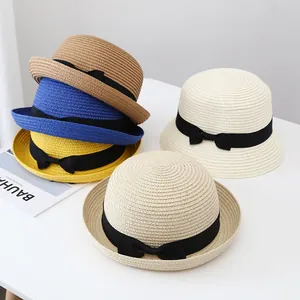 Chic summer straw bucket hats for women in multiple colors with elegant black ribbon bows