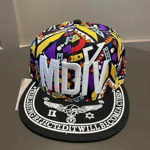 Top view of flat brim snapback featuring colorful geometric patterns and 3D embroidery