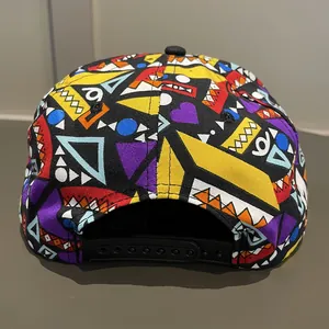 Detail view of adjustable black snapback closure on a colorful geometric print baseball cap