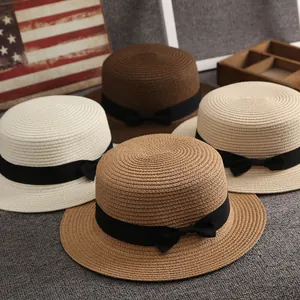 Cappelli di paglia a testa piatta per donna in quattro colori con elegante fiocco nero