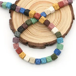 Colorful cube volcanic rock lava beads for DIY jewelry making on wooden slice
