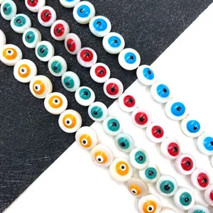 Macro detail of colorful evil eye shell beads for DIY jewelry making in multiple colors