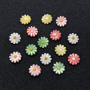 Macro detail of multi-colored daisy shell beads for DIY jewelry with pearl luster finish