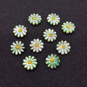 Macro shot of 10mm green and yellow resin daisy flower beads for DIY jewelry making