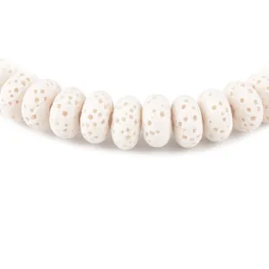 Macro view of white volcanic stone beads with porous texture for DIY jewelry making