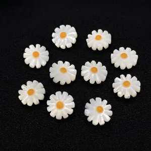 Macro detail of white shell sunflower beads with pearlescent luster for DIY jewelry