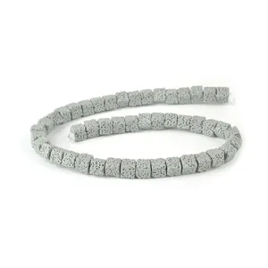 Macro detail of gray square lava stone beads with porous texture for DIY jewelry making
