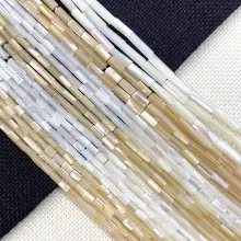 Macro view of cylindrical shell tube beads with natural mother of pearl luster for DIY jewelry