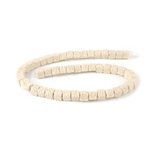 Close-up of square volcanic stone beads in creamy white with porous texture for DIY jewelry