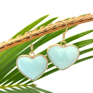 Elegant heart-shaped natural blue stone earrings with gold plated frames on branches
